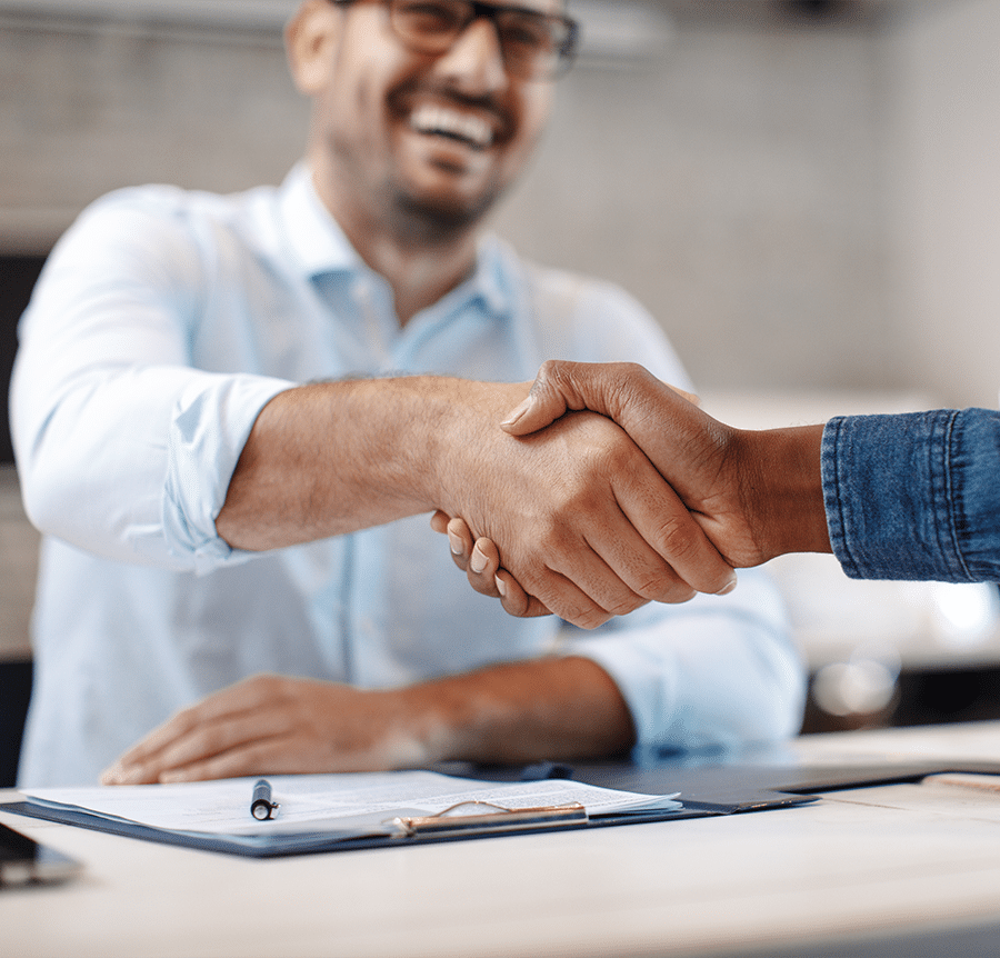 handshake at desk